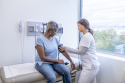 A woman receives care through Tricare Prime at a Military Treatment Facility.